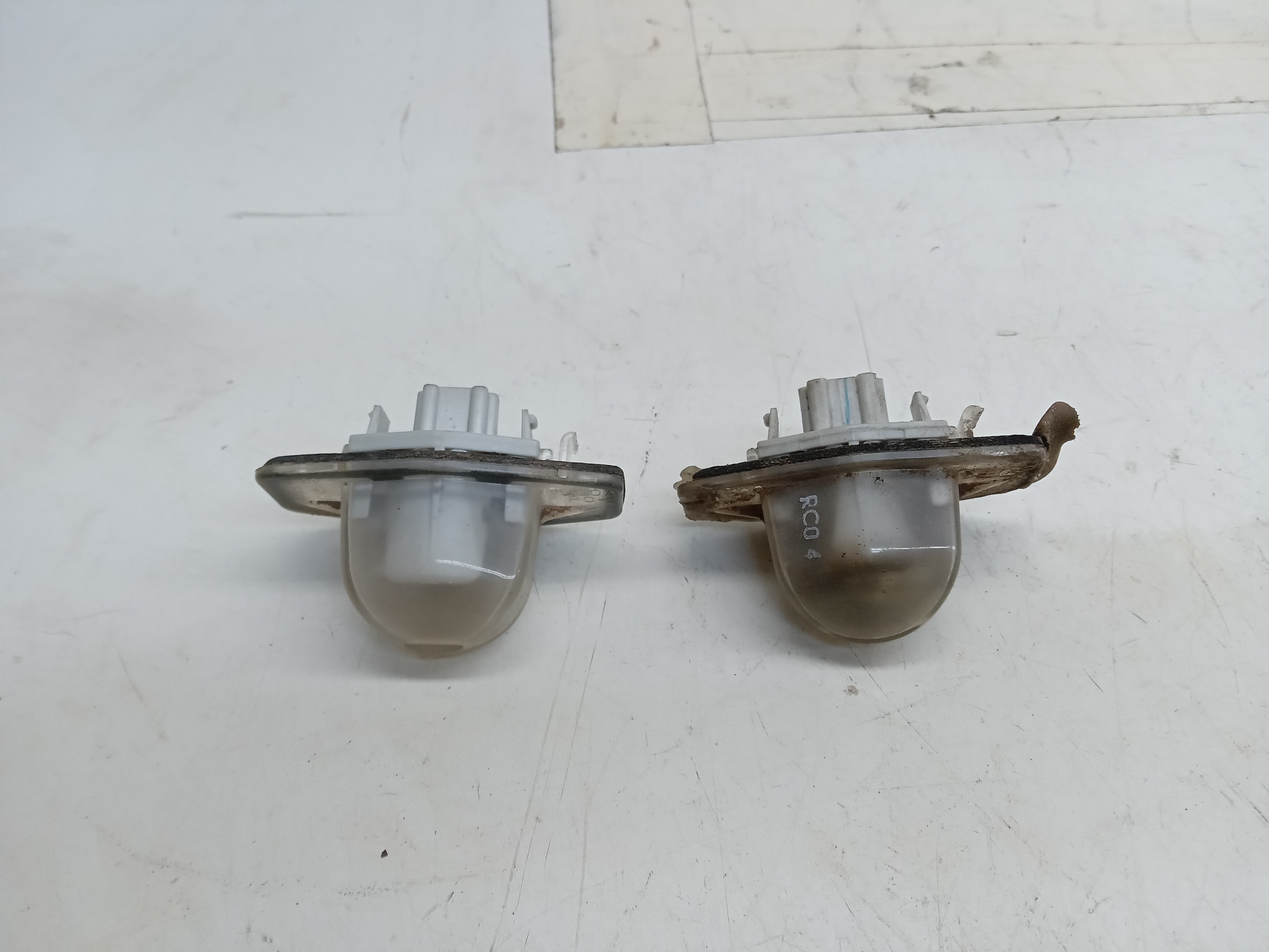 LUZ DE PLACA TRASEIRO HONDA FIT 2004