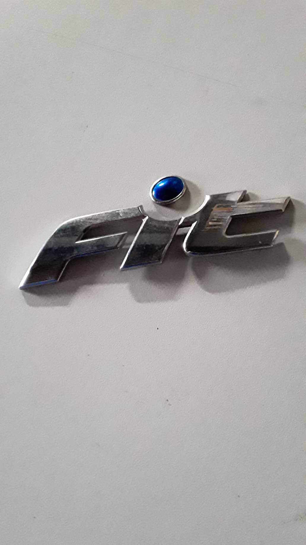 Emblema Tampa Traseira Original Escrito Fit 1