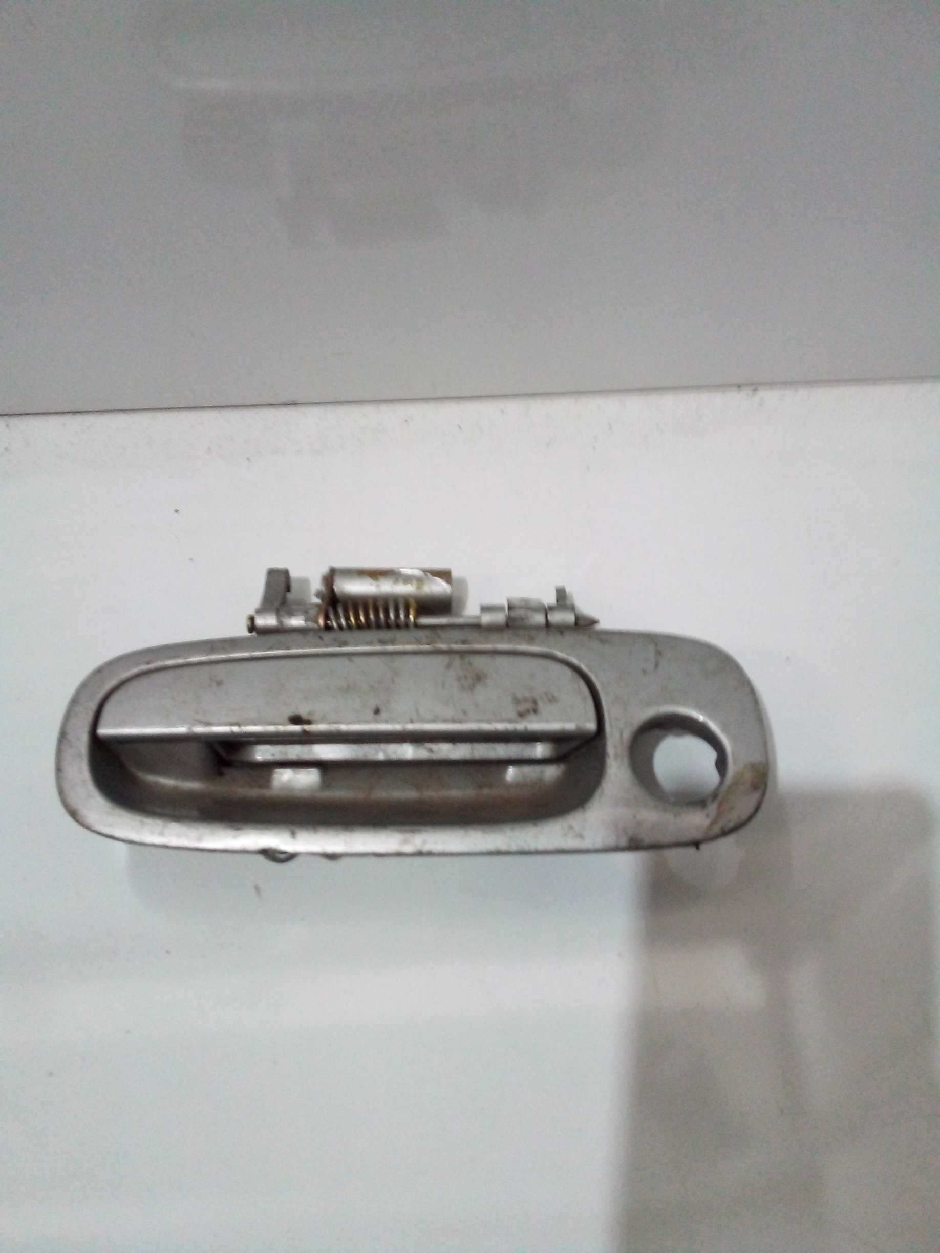 Maçaneta Toyota Corolla dianteira esquerda externa 99 1