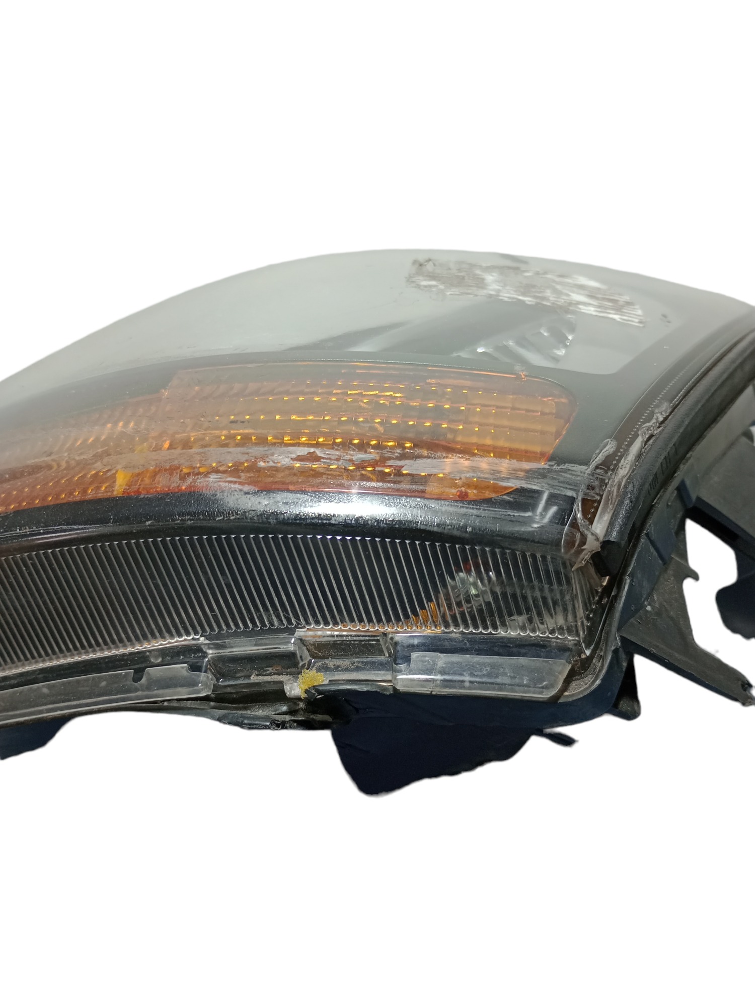 Farol L/E original tucson 2007 a 15 original detalhe lente 7